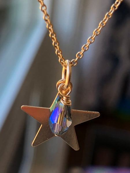 14KT gold filled 5 point star with single purple haze crystal dangling from the pendant.